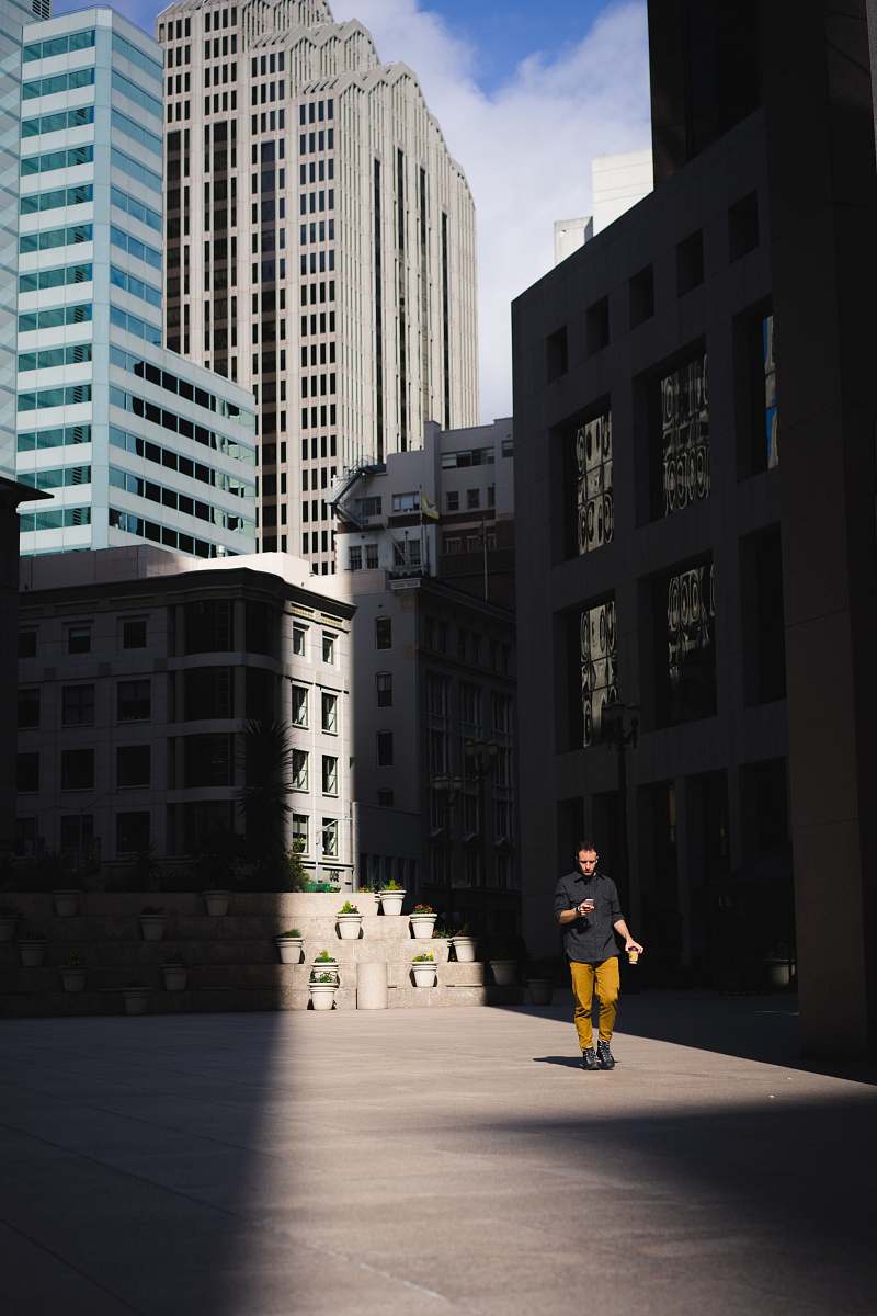 san francisco man standing beside building city